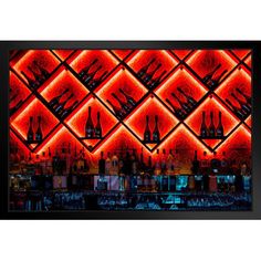 a bar with red lights and bottles on the wall