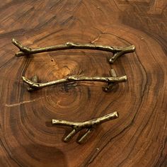 three pieces of wood that have been made into branches