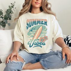 Summer vibes tshirt, surfing, surfboard, ocean lover, surfer  Celebrate summer with this cute retro surfing shirt! *Size up* for an OVERSIZED FIT (see size chart in listing photos). COMFORT COLORS Garment-dyed t-shirt, made 100% with ring-spun cotton. The soft-washed, garment-dyed fabric brings extra coziness to your wardrobe while the relaxed fit makes it an excellent daily choice. The double-needle stitching throughout the tee makes it highly durable while the lack of side-seams helps the shirt retain its tubular shape. Relaxed Fit RETURNS * All items are made-to-order. Because of the nature of these items, unless they arrive damaged or defective, we cannot accept return or exchange. CARE Machine Wash Cold, Inside Out, NO FABRIC SOFTENER! Hang to Dry Retro Surfing T-shirt For Beach Season, Summer Surfing Vsco T-shirt, Retro Letter Print T-shirt For Beach Season, Retro Text Print T-shirt For Beach, Trendy Cotton T-shirt For Surfing, Retro Funny Print T-shirt For Beach, Retro T-shirt With Funny Print For Vacation, Trendy Graphic Print T-shirt For Summer Adventures, Retro Beach T-shirt With Funny Print