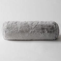 a white fluffy pillow on a gray background