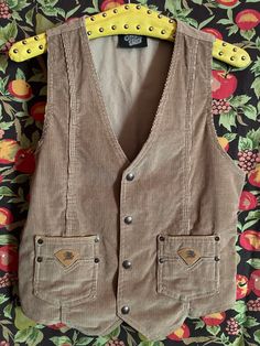 Vintage 70s western cowboy vest with pockets, snaps, cute detail. Rare and fabulous 70s Medium, no stretch  In good vintage shape Retro Fall Vest With Buttons, Vintage Fall Vest With Buttons, Retro Fall Vest With Pockets, Vintage Buttoned Winter Vest, Vintage Winter Vest With Button Closure, Vintage Buttoned Vest For Winter, Vintage Winter Vest With Buttons, Brown Cotton Vest With Button Closure, Retro Vest With Pockets