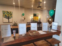 a table with some cards and balloons on it