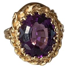 This antique Victorian ring features a natural oval-shaped amethyst center measuring 9.93 x 12.13mm framed in hand-engraved 10kt yellow gold with delicate piercing and floral embellishments. Victorian Yellow Gold Amethyst Ring For Formal Occasions, Victorian Gold Amethyst Ring With Center Stone, 14k Gold Victorian Amethyst Ring, Luxury Yellow Gold Victorian Amethyst Ring, Victorian 14k Gold Amethyst Ring Collectible, Antique Rings Victorian, Yellow Gold Cocktail Ring, Victorian Ring, Gold Cocktail Ring