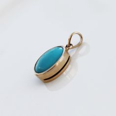 > Material - 14K Solid Yellow Gold > Gemstone - Turquoise > Stone weight - 6.460 ct > Number of stone - 1 piece Turquoise is perhaps the oldest stone in man's history, the talisman of kings, shamans, and warriors. It is a stone of protection, strong and opaque, yet soothing to the touch, healing to the eye, as if carved from an azure heaven and slipped to earth. Its unique shade of blue, often blue-green, lends it name, Turquoise, to all things of this tranquil hue. The delicate vein Fine Jewelry Turquoise Pendant Necklace, Fine Jewelry Turquoise Pendant Necklace Gift, Dainty Yellow Gold Turquoise Necklace For Gift, Turquoise 14k Gold Round Pendant Jewelry, 14k Gold Turquoise Pendant Jewelry, Yellow Gold Oval Turquoise Necklace Gift, Oval Turquoise Necklace In Yellow Gold As Gift, Oval Yellow Gold Turquoise Necklace As Gift, 14k Gold Turquoise Necklace For Gift