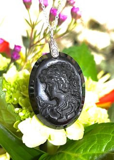 "Big, long, cameo, oval, natural, black onyx pendant necklace set in 925 sterling silver, with 18\" sterling silver chain. Stone Size: 40mm x 30mm. 17 Grams Stone Weight/85-carats." Black Cameo Medallion Jewelry, Black Cameo Medallion Necklace, Black Round Cameo Jewelry, Silver Oval Intaglio Necklace, Black Cameo Necklace As A Gift, Black Intaglio Jewelry As A Gift, Black Cameo Necklace Gift, Black Cameo Necklace For Gift, Black Cameo Jewelry As A Gift