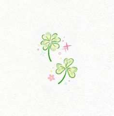 two clovers with pink and green flowers in the middle on a white paper background