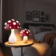 two mushroom lamps sitting on top of a table