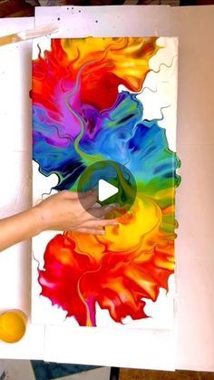 a person is painting an art project with acrylic paint