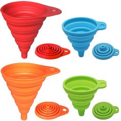 four different colored funnels with holes in the middle and one has an upside down cone