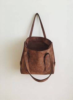 "This tote bag is made of high quality vegan leather in brown. It is soft and lightweight but durable. It stands on its own. It has a rustic, distressed look. It has one interior zipper pocket. Straps are adjustable. Measurements: 32 x 30 x 15 cm IMPORTANT! Your orders between 7-25 August will be shipped on August 28. Delivery takes 2-5 days to the US, Canada, Australia and Europe; in 3-7 days to rest of the world after shipping. For other color options you can check \"Totes\" section: http://et Dark Tan Leather Bag For On-the-go, Brown Bag With Large Capacity For On-the-go, Brown Bucket Tote Bag For Daily Use, Brown Tote-shaped Bucket Bag For Daily Use, Brown Tote Bucket Bag For Daily Use, Brown Double Handle Shoulder Bag For On-the-go, Versatile Large Capacity Brown Bag, Brown Large Capacity Softback Bag, Versatile Brown Bag With Adjustable Strap