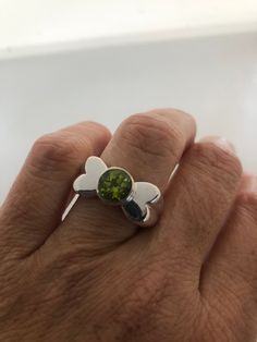 Rich bright Peridot green ring Sterling silver Tarnished with age, can be polished up. Size 7 can be sized by my jeweler. His service charge is $10-$20 All rings are shipped free in the US in a nice gift box. Check out our over a THOUSAND great reviews Engraving is $4 per letter and is not always perfect depending on the piece. It can take a few days if the jeweler is busy. This is payable to Paypal Judithsltd@gmail.com Lime Green Sterling Silver Rings As Gift, Lime Green Sterling Silver Rings For Gift, Green Sterling Silver Open Ring, Green Sterling Silver Rings With Polished Finish, Green Polished Finish Rings As Gift, Green Rings With Polished Finish As Gift, Green Polished Finish Rings For Gift, Green Peridot Jewelry With Polished Finish, Green Polished Peridot Jewelry