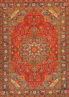 an orange and red rug with many different colored designs on the bottom, in various colors