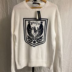 Polo Ralph Lauren White Crest Logo Embroidered Cotton Knit Sweater - Men's Size Large - Brand New With Tags. Classic White Sweater With Embroidered Logo, Classic Embroidered Logo Sweater For Winter, Classic Winter Sweater With Embroidered Logo, White Embroidered Logo Sweater For Fall, Designer White Winter Sweater, Designer White Sweater, Designer White Long Sleeve Sweater, Classic Winter Top With Embroidered Logo, White Cotton Polo Sweater With Ribbed Cuffs