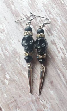 FREE DOMESTIC SHIPPING ONLY Please read the shipping, policies, and procedures Personal handmade fave! Spooky cool black skull earrings accompanied by matte black rounds, diamond-like crystal rondelles, and glass jet black bicone with silver dangling spikes. The earrings dangle at 2.75 inches (1cm in width), very light weight. The black skulls have intricate detailing and the earrings are created with silver tone plated precious metals. These earrings make a great fashion statement, especially f Black Edgy Dangle Earrings, Edgy Black Dangle Earrings, Adjustable Black Skull-shaped Earrings, Edgy Dangle Earrings For Halloween, Black Skull Earrings For Gift, Adjustable Black Skull Earrings, Nickel-free Black Punk Earrings, Black Nickel-free Punk Earrings, Punk Skull Earrings For Party