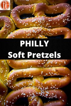 there are many soft pretzels with sesame seeds on them and the words phily soft pretzels