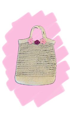 a white purse with pink flowers on the handle and handles, against a pink background