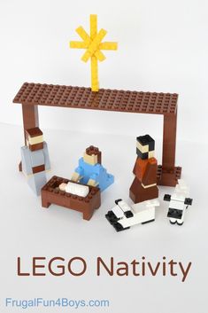 a lego nativity scene with two men and a baby