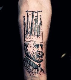 a man's arm with an inked portrait of a man wearing a crown