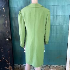 "Crazy unique vintage 60's/ 70's mod lime green/ chartreuse high low blazer jacket. Semi cropped in the front, duster length tail in back. Slightly puffed sleeve. Longer sleeve, looks great rolled once. 4 buttons in front with a secret black one being most important. Most likely polyester. Acetate feel lining. No tags! Definitely one of a kind. Will best fit women's medium. Good vintage condition, with signs of age and wear. Such a very rad piece. Im obsessed. Measurements laying flat: fabric do Retro Green Formal Outerwear, Fitted Green Outerwear For Spring, Vintage Tailored Green Blazer, Vintage Green Formal Outerwear, Vintage Green Outerwear For Formal Occasions, Tailored Green Outerwear For Spring, Vintage Green Single-breasted Blazer, Vintage Green Single Breasted Blazer, Green Vintage Single-breasted Blazer