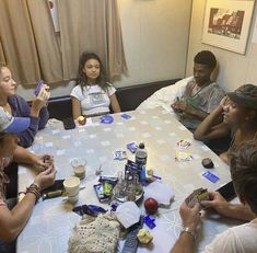 a group of people sitting around a table