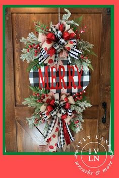 a christmas wreath with the word merry hanging on a front door hanger that is decorated with red, black and white plaid ribbon