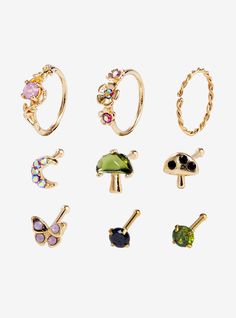 six pairs of rings with different colors and designs on each one, all in gold