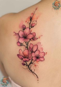 a woman's back with pink flowers painted on her shoulder and behind it is a watercolor painting