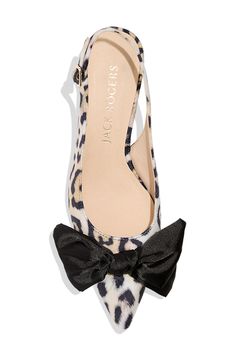 A classic bow add a touch of drama to the pointy toe of this slingback pump lofted by a kitten heel. 1 3/4" heel Adjustable slingback strap with buckle closure Cushioned footbed textile upper/leather lining/rubber sole Imported Chic Kitten Heels With Bow Straps For Evening, Evening Kitten Heels With Bow Straps, Chic Kitten Heels With Bow And Ankle Strap, Chic Kitten Heels With Bow And Pointed Toe, Chic Low Heel Kitten Heels With Bow, Chic Bow Kitten Heels, Chic Slingback Pumps With Bow And Flat Heel, Chic Flat Heel Slingback Pumps With Bow, Chic Black Kitten Heels With Bow