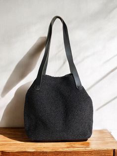 Any woman must have this bag for every fashionista. Whether you keeping it to yourself or gifting someone you care, it will be unforgettable. ✔️I made this beautiful bag from natural paper rope which is organic cotton and vegan leather in black. ✔️The interior of the straw summer bag is fully lined with cotton and has a magnetic button. Suitable for use as shoulder bag, beach bag, travel bag or party bag. ✔️The bag has cotton lining. A lining of the appropriate color is sewn into the crochet pap Trendy Beach Hobo Bag With Leather Handles, Trendy Hobo Bag With Leather Handles For Beach, Trendy Hobo Bag With Leather Handles For Vacation, Black Rectangular Bucket Bag For Beach Season, Rectangular Black Bucket Bag For Beach Season, Large Capacity Black Crochet Bag For Vacation, Eco-friendly Black Crochet Bag For Travel, Black Bucket Bag With Large Capacity For Vacation, Vacation Handheld Shoulder Bag With Leather Handles