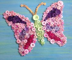 a butterfly made out of buttons on a blue background