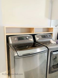 a couple of washers and dryers in a room