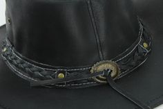 Our smooth leather cowboy hats are made of genuine cowhide leather. This beautifully handcrafted hat is made with fine craftsmanship and materials. Any scars, wrinkles or other subtle variations are characteristics of natural leather and do not affect its strength or quality. The unisex leather hat is embellished with brass conchos. The crown of the had also boasts a braided hat band. Use the strap for windy days or to keep it around your neck while traveling so you won't lose it. Perfect access Western Braided Hat Band With Flat Brim, Braided Western Hat Bands, Western Style Braided Hat Bands For Flat Brim, Vintage Leather Hat Band For Rodeo, Western Braided Fedora Hats, Braided Western Fedora Hats, Braided Western Hat Bands For Rodeo, Western Braided Hat Bands For Rodeo, Western Braided Hat Band For Ranch