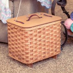 a basket sitting on the floor next to a chair