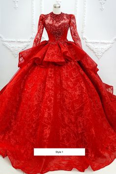 a red ball gown with long sleeves on display