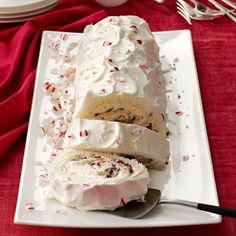 a white plate topped with cake and frosting