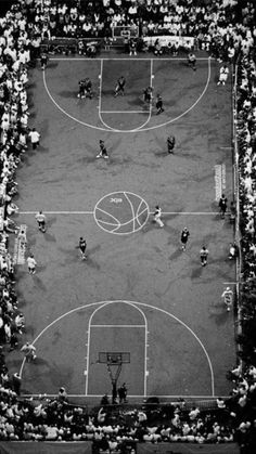 an aerial view of a basketball court with spectators