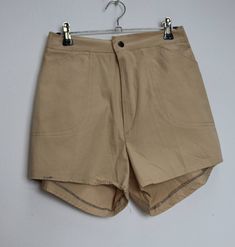 "a vintage pair of cream/beige cotton shorts ✿ IMPORTANT INFORMATION: * excellent vintage condition * size: small - please check exact measurements below (they're there for your benefit!) * garment care: machine washable ✿ MEASUREMENTS (taken while item is lying flat, some measurements will need to be doubled): * waist: 12.5-15\" (32-38cm) - elasticated * hips: 18\" (46cm) * front rise: 12\" (30cm) * back rise: 15\" (38cm) * leg in-seam: 2.5\" (6.5cm) * leg out-seam: 13\" (33cm) * thigh width: 1 Vintage Cotton Cargo Shorts With Pockets, Vintage Cotton Khaki Shorts, Cream Cotton Shorts, High-waisted Cream Cotton Shorts, Cream High-waisted Cotton Shorts, High Waist Khaki Cotton Shorts, Khaki High Waist Cotton Shorts, Vintage Beige Bottoms With Pockets, Khaki Cotton High Waist Shorts