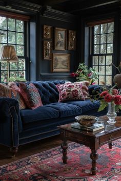 a living room filled with lots of furniture and flowers on top of a coffee table