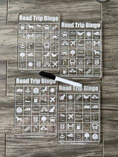 road trip tri - lingo game cards on a wooden table with a black pen