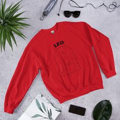 The perfect sweater for any Leo who loves a casual but trendy look! Leos are born between 23rd July - 22nd August. They are the 5th sign of the zodiac. A sturdy and warm sweatshirt bound to keep you warm in the colder months. A pre-shrunk, classic fit sweater that's made with air-jet spun yarn for a soft feel and reduced pilling. * Unisex sweater for any Zodiac lover * 50% cotton, 50% polyester * Pre-shrunk * Classic fit * 1x1 athletic rib knit collar with spandex * Air-jet spun yarn with a soft Halloween Parejas, Men Crewneck, Heart Sweatshirt, Dog Sweatshirt, Embroidered Crewneck, Womens Crewneck, Workout Sweatshirt, Embroidered Sweatshirts, Fitted Sweater