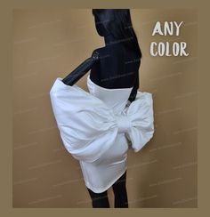 a mannequin wearing a white dress and black stockings