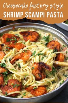 shrimp scampi pasta in a skillet with parsley on top and the words, cheesecake factory style shrimp scampi pasta