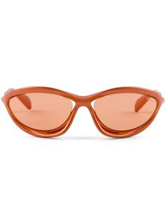 orange shield frame sculpted design orange tinted lenses UV-protective lenses lens decal logo-stamped curved tips These glasses come with a protective case. Prada Eyewear, Logo Stamp, Sunglass Frames, Protective Cases, Sunglasses Accessories, Prada, Lenses, Sunglasses, Luxury Fashion