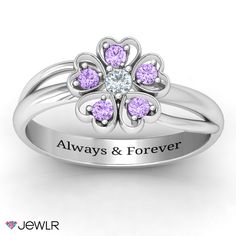 This adorable ring features a simple flower design with heart shaped petals and a beautiful glistening birthstone in the center as well as in each petal. The shank is solid and has two freeform decorative pieces adding to the femininity and beauty of the ring. Give this beautiful piece to a woman who loves receiving flowers but deserves one that is personalized just for her and will never stop blooming! Flower-shaped Anniversary Rings With Accent Stones, Flower-shaped Rings With Accent Stones For Anniversary, Flower Shaped Rings With Accent Stones For Anniversary, Gemstone Flower Ring For Anniversary, Flower Shaped Gemstone Ring For Anniversary, Fine Jewelry Birthstone Flower Promise Ring, Diamond Flower Ring With Birthstone For Anniversary, Elegant Flower Ring With Birthstone For Anniversary, Fine Jewelry Flower-shaped Birthstone Promise Ring