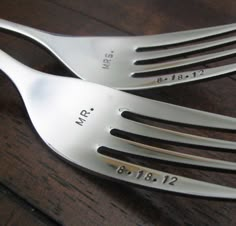 two forks with the names mr and mrs engraved on them