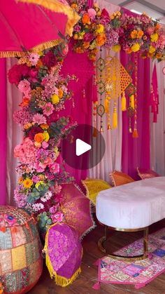 a bedroom decorated in pink and yellow with lots of flowers