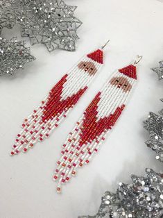 Santa shoulder duster earrings long Christmas seed bead | Etsy Christmas Festive Beaded Dangling Earrings, Christmas Dangle Beaded Earrings With Colorful Beads, Christmas Colorful Beaded Dangle Earrings, Holiday Beaded Dangle Earrings, Bohemian Christmas Earrings For Festive Occasions, Festive White Beaded Earrings With Dangling Beads, Festive White Beaded Dangling Earrings, Festive White Dangling Beaded Earrings, Christmas White Beaded Dangle Earrings