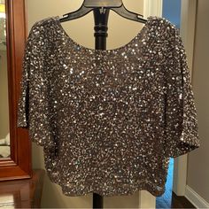 New With Tags! Approx 21” Long From Top Of Shoulder. Perfect For Going Out! Silver Sequined Short Sleeve Tops, Silver Sequined Tops For Night Out, Glamorous Metallic Silver Tops For Night Out, Silver Sequin Tops For Evening, Silver Sequin Blouse For Party, Silver Shimmer Tops For Night Out, Glamorous Silver Tops For Night Out, Glamorous Silver Evening Top, Glamorous Silver Top For Evening