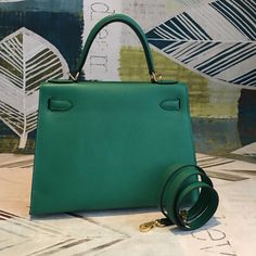 Description HRMS Kelly 28 Vert Jade Green Bag For Women, Handbags, Shoulder Bags 11in/28cm Rep 1:1 Size: 28 x 22 x 10 cm / 11 x 8.5 x 4.5 inches (Length x Height x Width) Hermès bags are considered the ultimate luxury item worldwide. Each piece is handcrafted with waitlists that can exceed a year or more. The streamlined and demure Kelly style is always in high demand, it is particularly lovely in this vibrant version with gold hardware. Epsom is textured with a wonderful grainy appearance. Epso Verde Jade, Louis Vuitton Shirt, Hermes Kelly 28, Fendi Peekaboo, Grey Bag, Hermes Bags, Evening Clutch Bag, Jade Green, Bag For Women