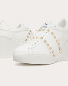 Valentino Garavani Open Disco wedge trainer in calfskin - Band with platinum-finish studs - Special label with number 11 - Rubber sole with rubber stud detail on the back - Sole height: 85 mm / 3.35 in. with 30 mm / 1.2 in. platform - Made in Italy Luxury Studded Platform Sneakers With White Sole, Luxury Low-top Platform Sneakers With Studded Outsoles, Luxury Leather Platform Sneakers With Studded Outsoles, Luxury White Studded Sneakers, Luxury White Sneakers With Spikes, Luxury White Spiked Sneakers, Wedge Trainers, Woman In White, Number 11